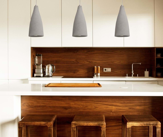 Pendant lights featured over a kitchen island
